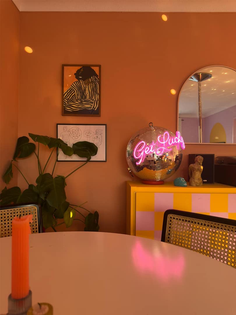 Terracotta-living-room-with-discoball-lights-Georgie-Web-Art-Bristol